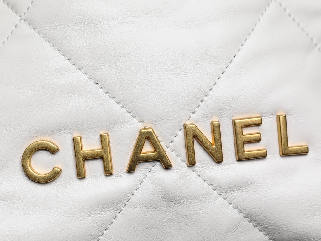 CHANEL 22 MINI HANDBAG GOLD LOGO SS2023 WHITE