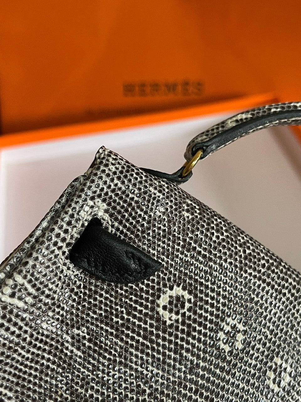 Hermes Kelly Idole (Kelly Doll) in Lizard with Gold hardware.