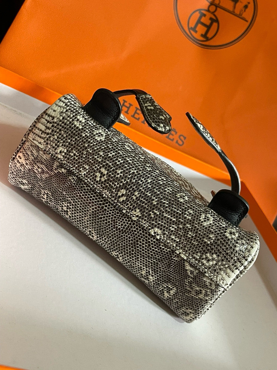 Hermes Kelly Idole (Kelly Doll) in Lizard with Gold hardware.