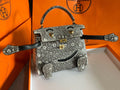 Hermes Kelly Idole (Kelly Doll) in Lizard with Gold hardware.