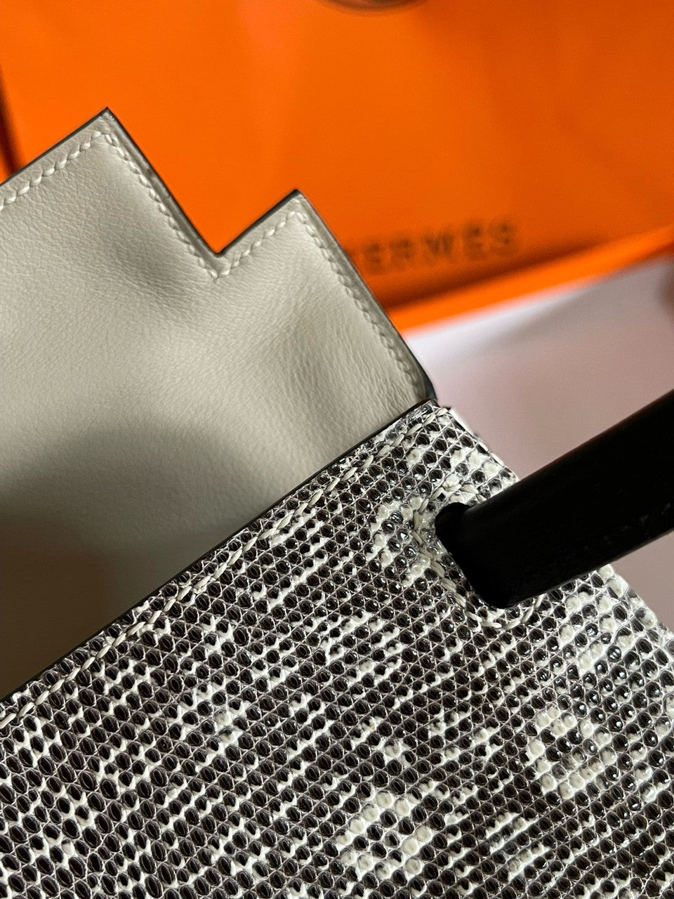 Hermes Kelly Idole (Kelly Doll) in Lizard with Gold hardware.