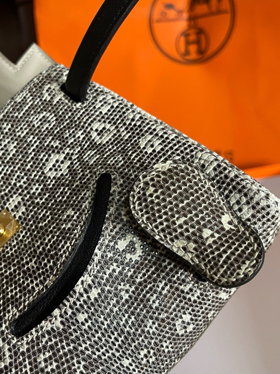 Hermes Kelly Idole (Kelly Doll) in Lizard with Gold hardware.