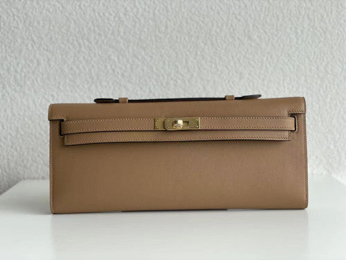 Hermes Kelly 31cm Cut Pochette gold Swift