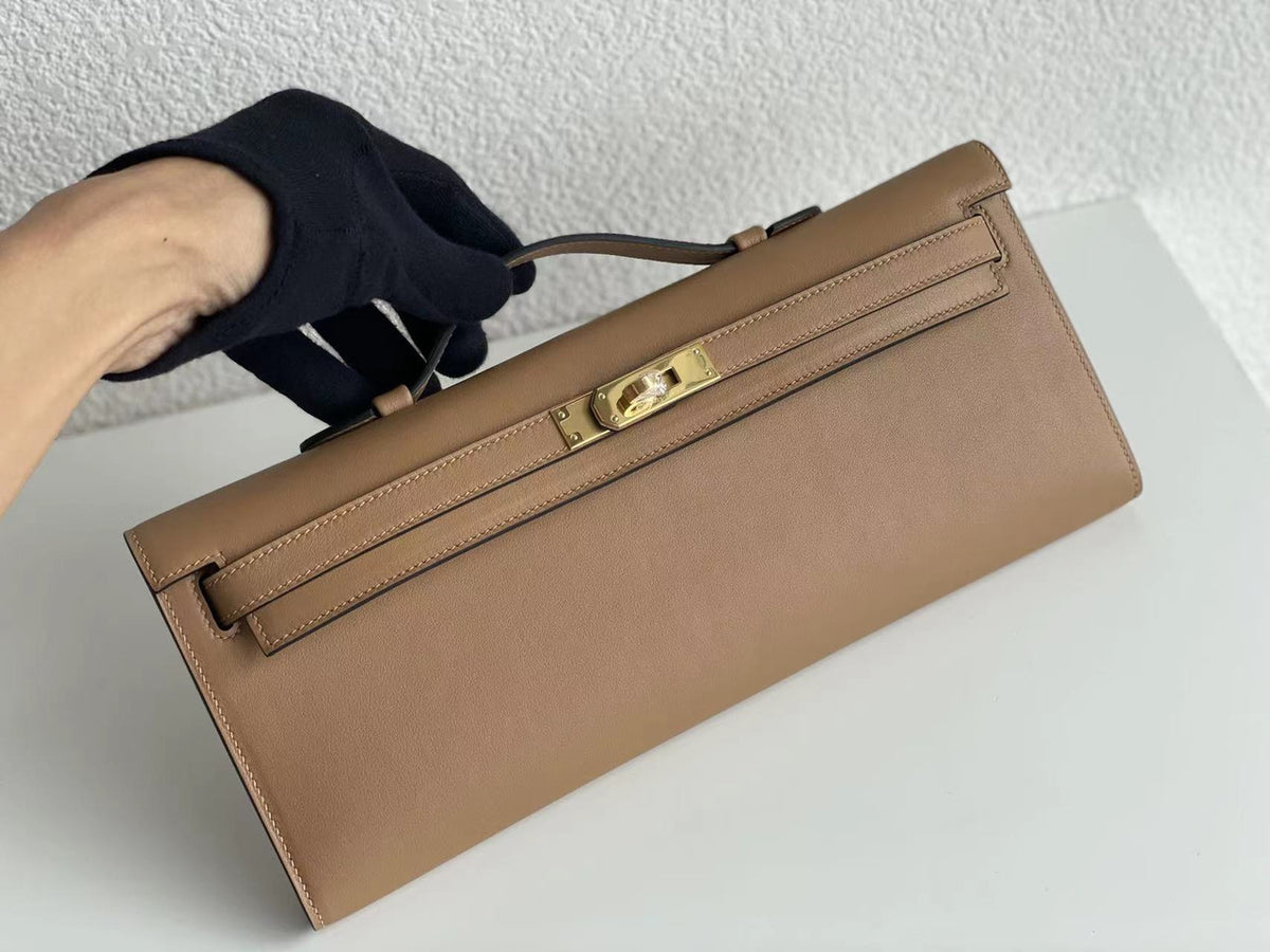 Hermes Kelly 31cm Cut Pochette gold Swift