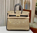 HERMÈS 25CM BIRKIN CUSTOMIZED SWAROVSKI CRYSTAL GOLD HARDWARE WITH GOLD AND BLACK SWIFT LEATHER Hermes