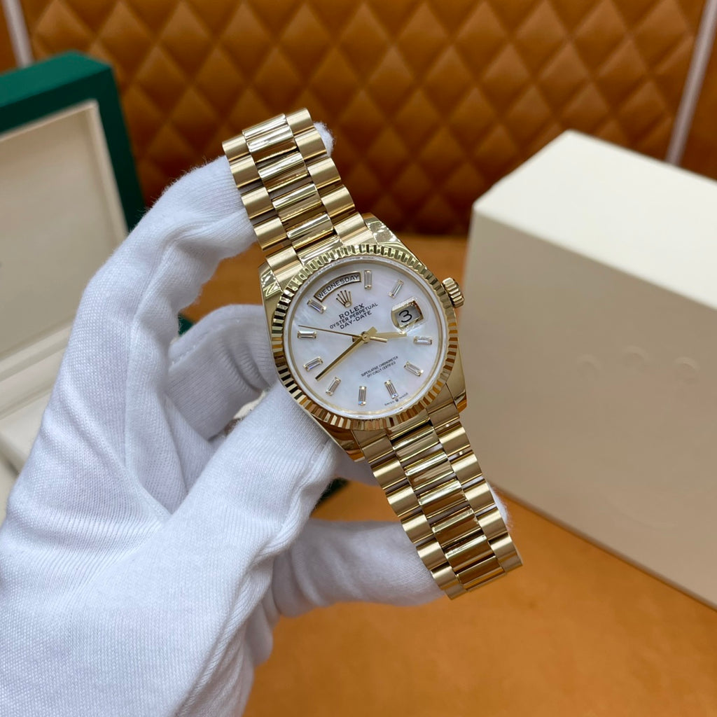 ROLEX DAY-DATE 36 18k Yellow Gold | White Mother-of-Pearl Baguette Dial | President Bracelet